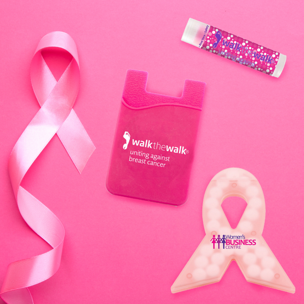 Pink breast cancer awareness items on a pink background.