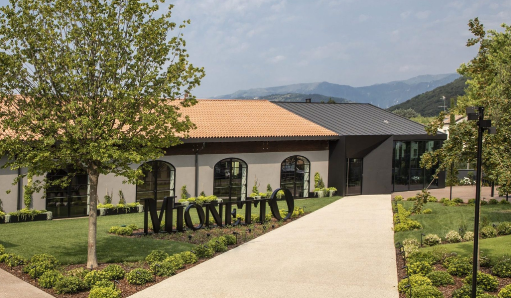 Mionetto winery building with landscaped garden.